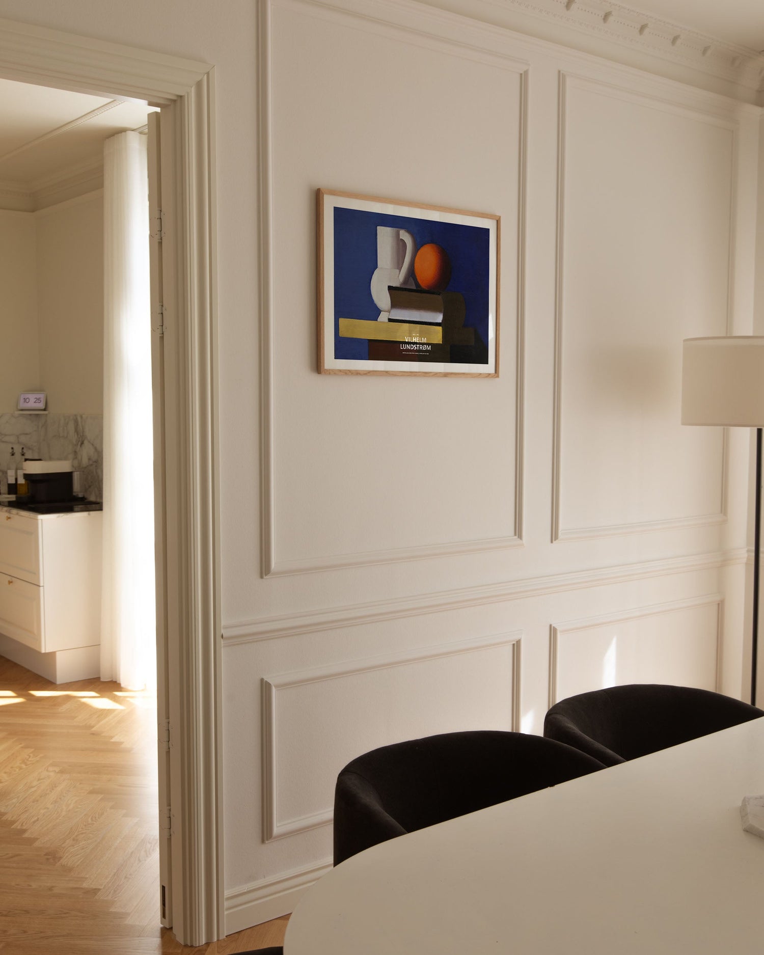 Setup with white jug, orange, and book