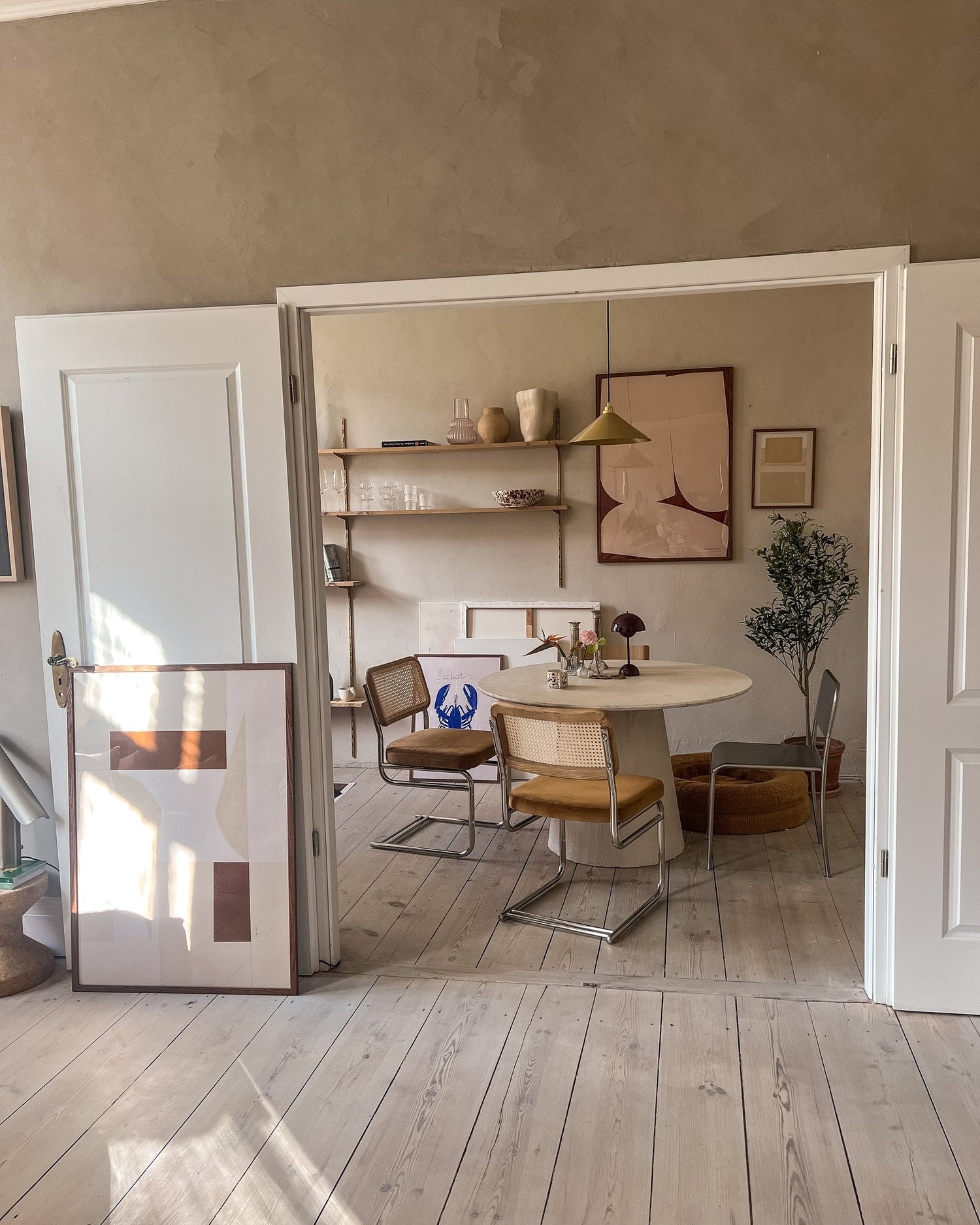 Curated poster wall with a minimalist expression