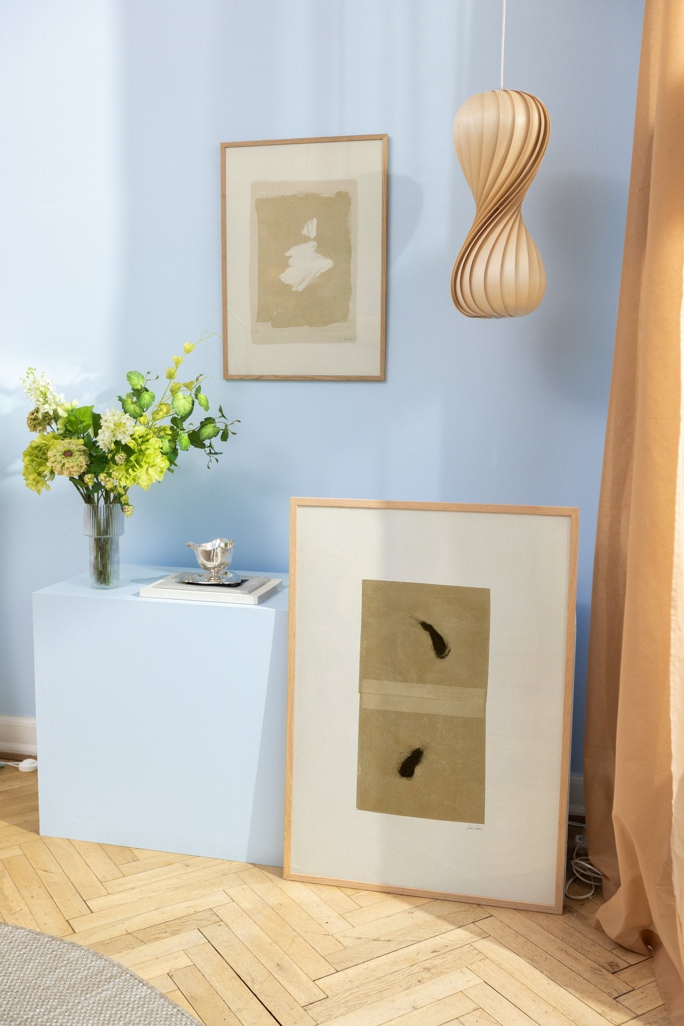Beige art prints in bluish surroundings