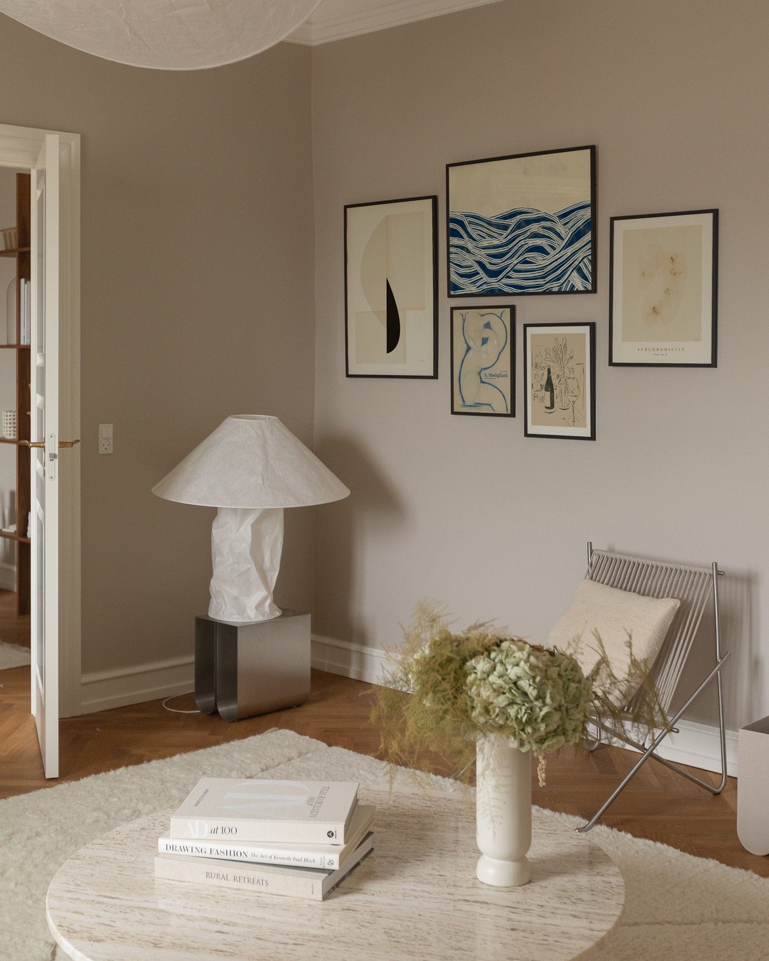 Poster wall with blue and neutral colors