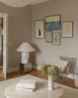 Poster wall with blue and neutral colors