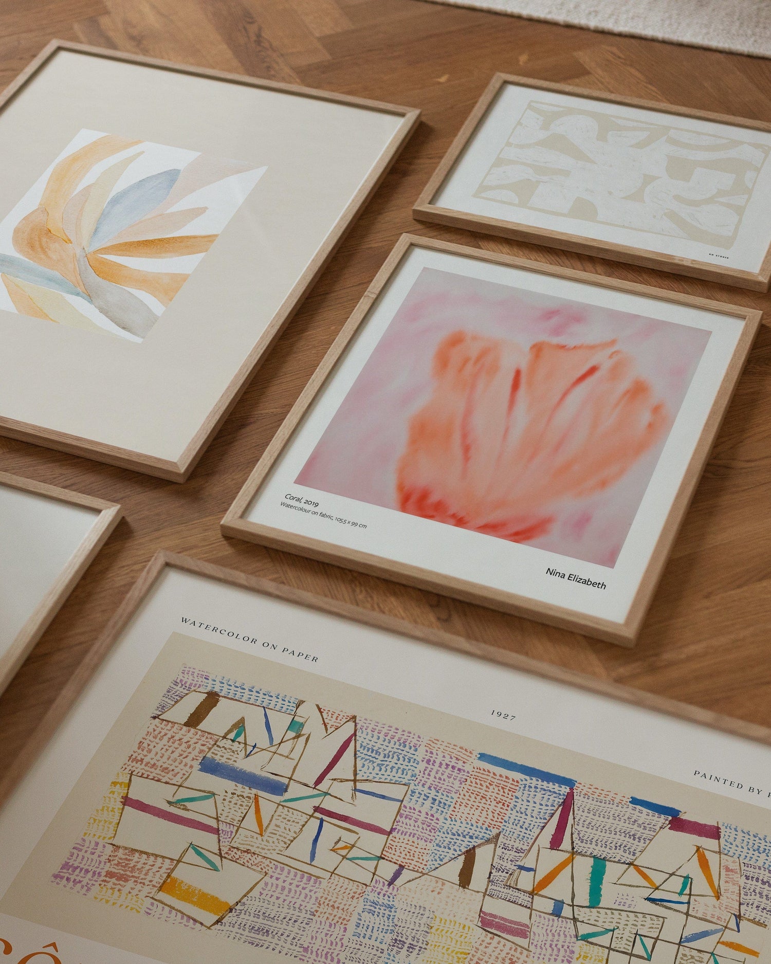 Colorful composition of art prints on the floor