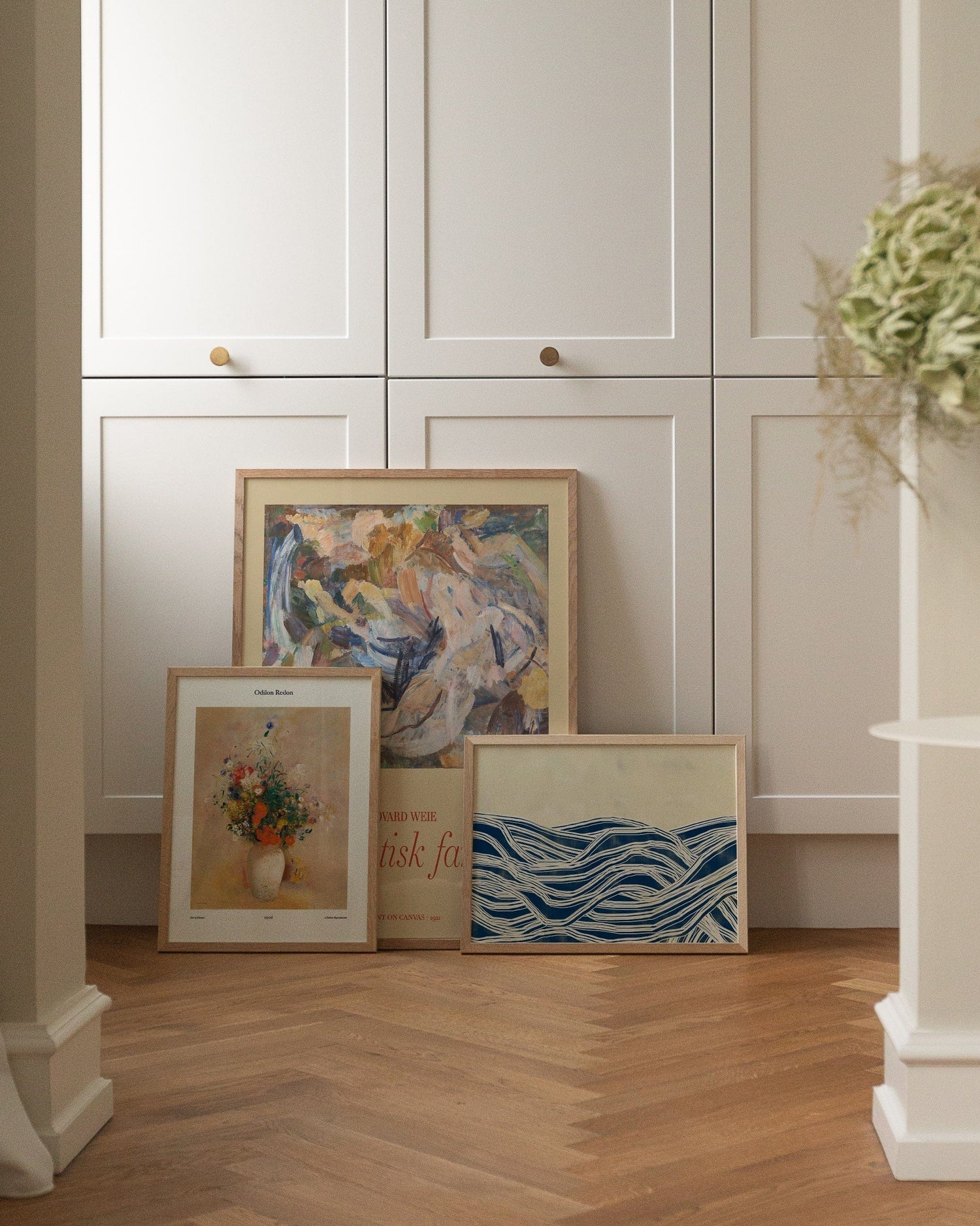 Art prints on top of cabinet